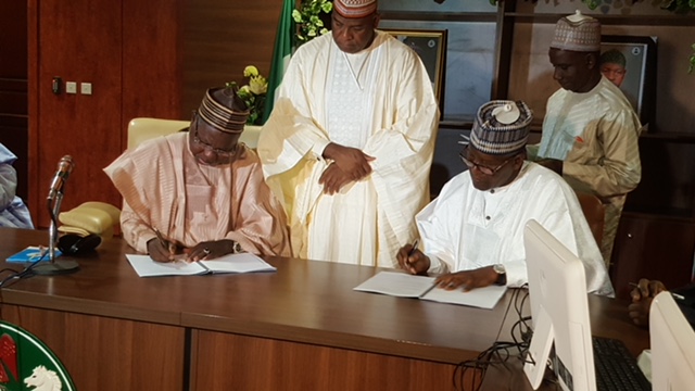 L-R: The Executive Governor, Katsina State, Aminu Bello Masari and Group President/CE, Dangote Group, Aliko Dangote, at the official signing and handing over ceremony of Songhai Project to Dangote