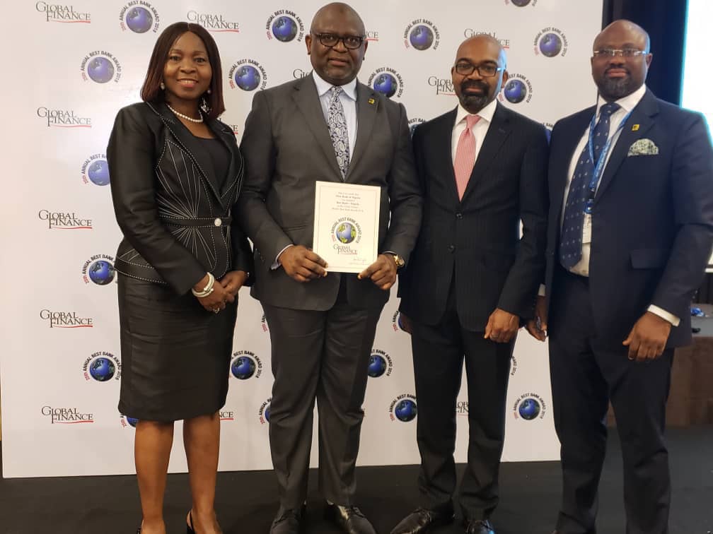 Adesola Adeduntan, MD/CEO, First Bank of Nigeria Limited & Subsidiaries (second left) flanked by FirstBank's Bashirat Odunewu, Group Executive, International Banking Group, (left); Ini Ebong, Group Executive, Treasury & Financial Institutions (second right) and Timi George, Group Head, Financial Institutions & Multilaterals (right), during the presentation of Best Bank in Nigeria 2018 award to FirstBank in the Global Finance World Best Bank Awards 2018, held on the sidelines of the World Bank/IMF Annual Meetings in Bali, Indonesia. 