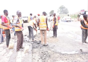 Group of workers fixing Highways