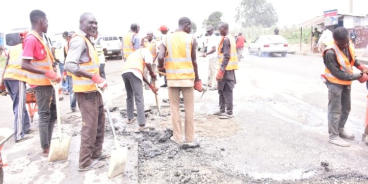 Group of workers fixing Highways