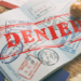 Illustration of a rejected visa document